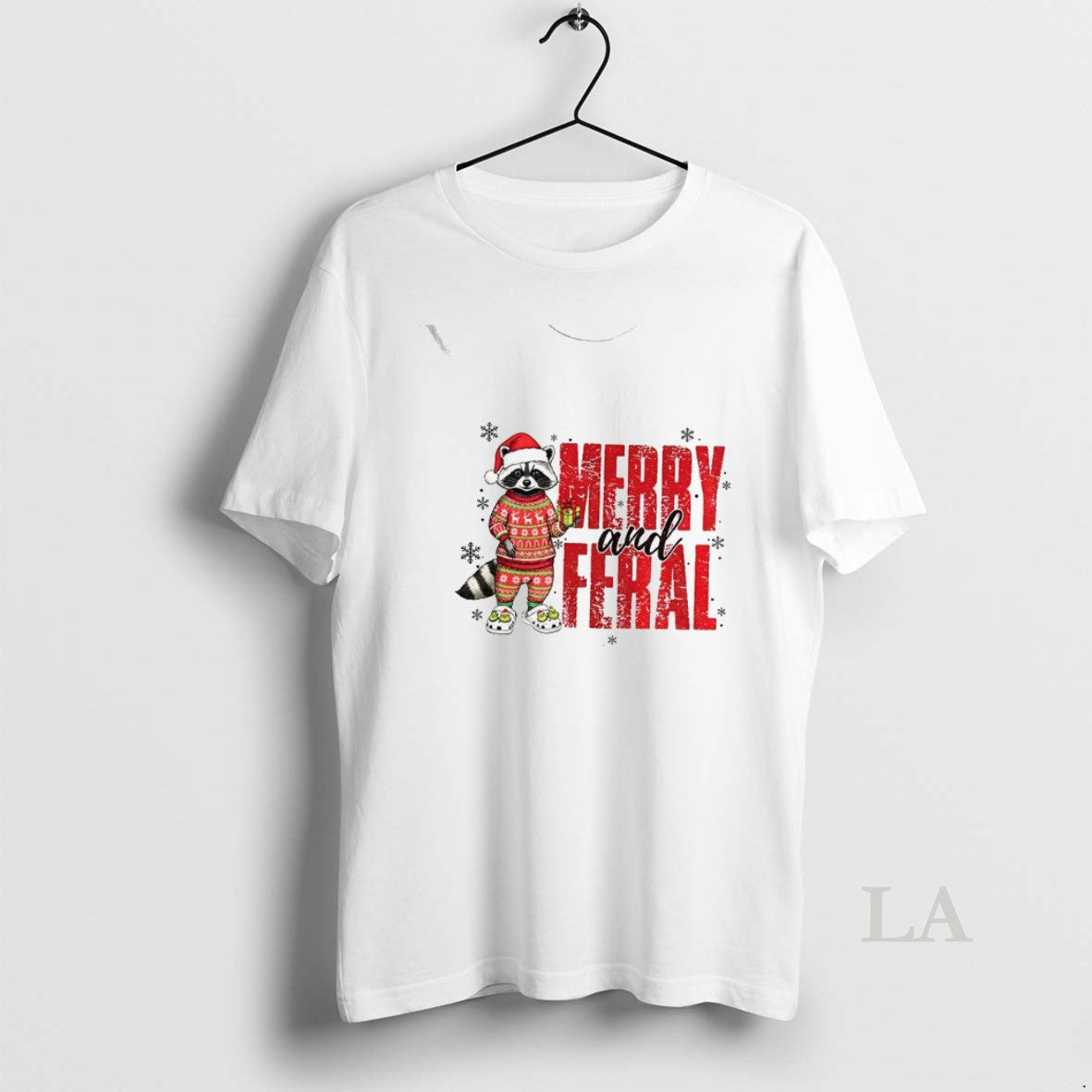 Original Funny Raccoon Santa Hat Merry And Feral Merry Christmas 2025 T-Shirts, Hoodie, Sweatshirt | InkNestWear.com