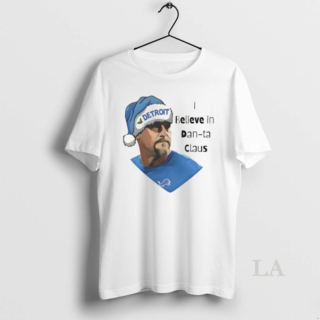 Original I Believe In Dan Ta Claus Dan Campbell Detroit Lions Football Christmas 2025 T-Shirts, Hoodie, Sweatshirt