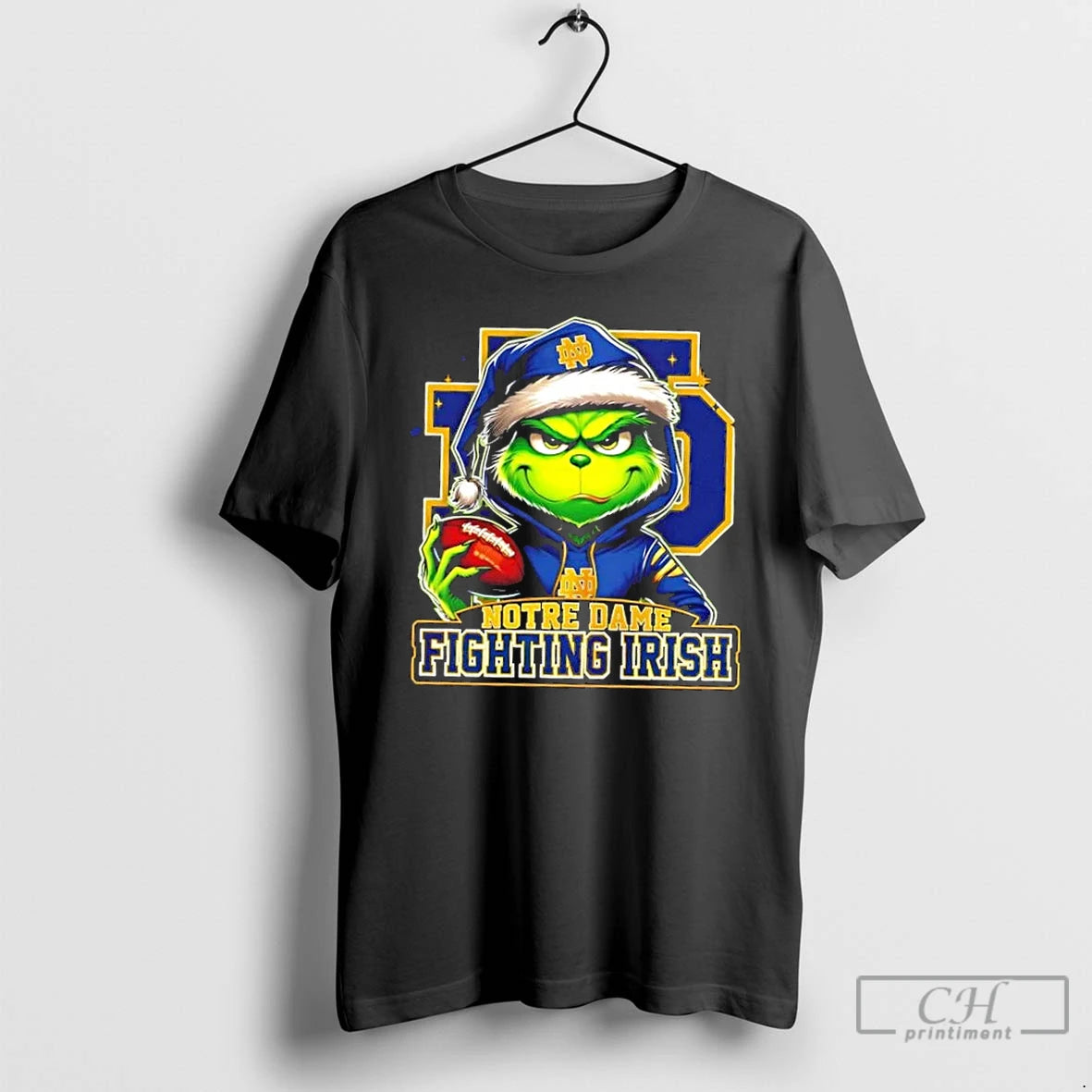 Premium Grinch Is Holding A Ball And Smiling At Notre Dame Fighting Irish Fans Christmas T-Shirts, Hoodie, Sweatshirt